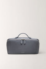 Front view of portable blue makeup organizer bag, soft texture toiletry pouch for travel