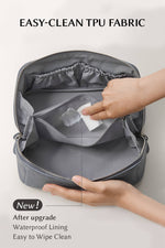 Close-up of easy-clean TPU waterproof lining, stain-resistant makeup bag interior being wiped clean
