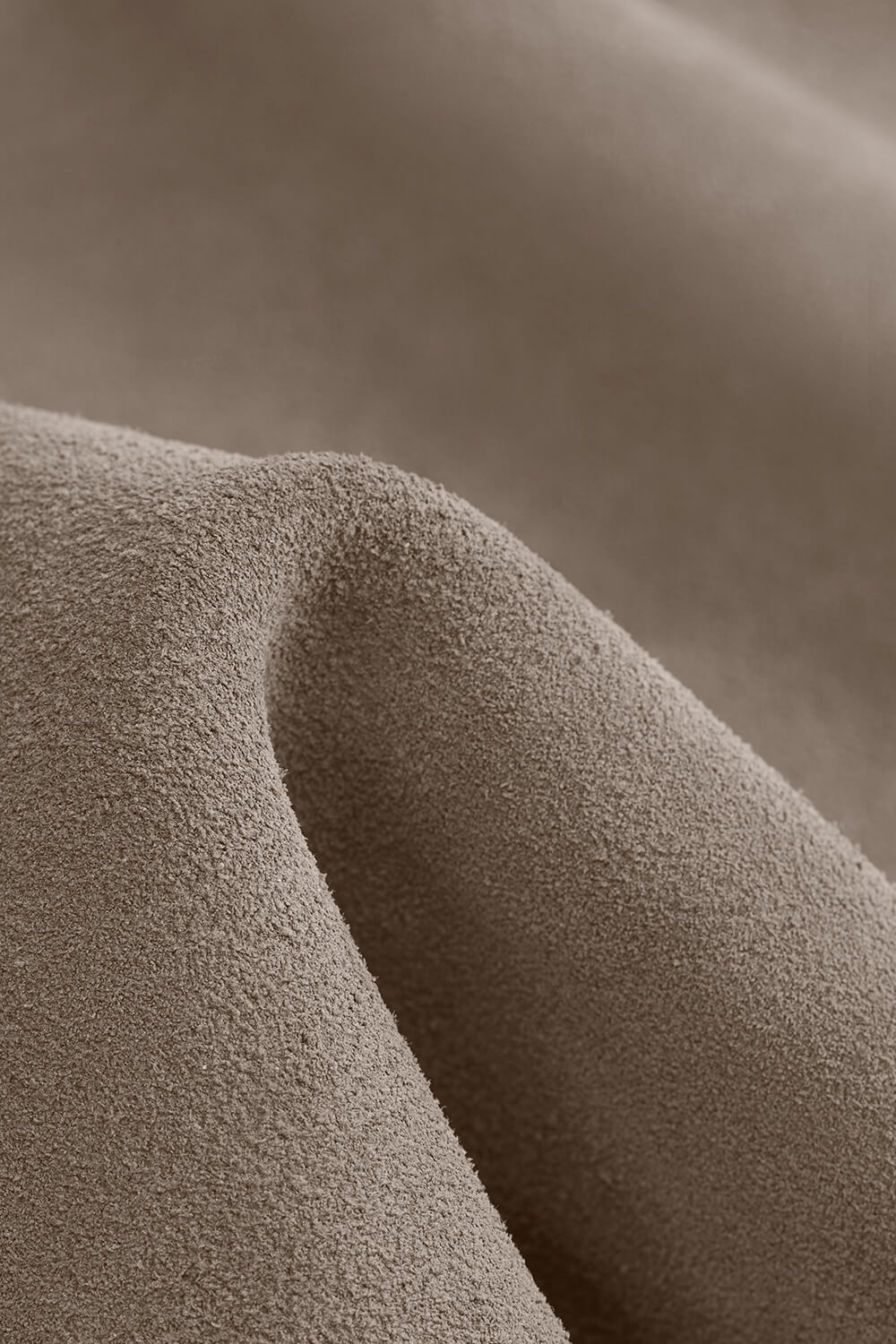 Close up soft PU leather texture on gray toiletry pouch