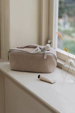 Aesthetic gray makeup organizer sitting on window sill for home decor