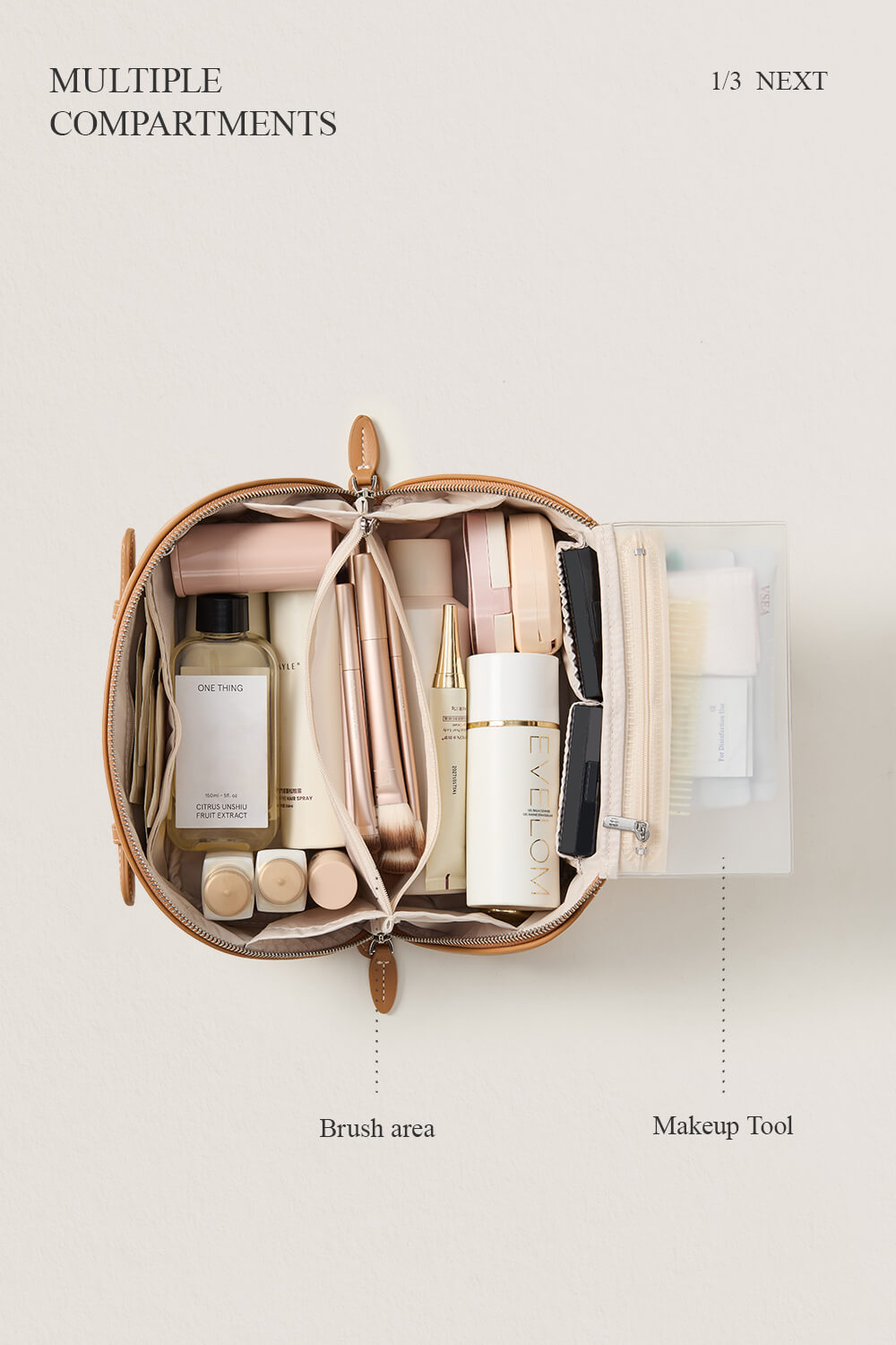 Model packing a camel makeup bag on bed, essential travel cosmetic bag for women.