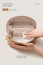Close-up of brown makeup bag handle, durable leather toiletry bag for travel.